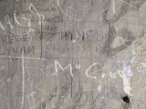 Deep engraving located in the cell of Patrick Pearse. Text inside the signage 'J Hynes / Nov 1922'